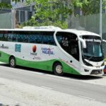 Travel group boarding bus coordinated by a B2B travel team