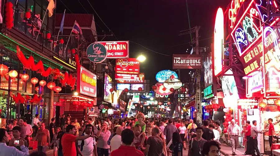 Neon lights and crowd at Pattaya Walking Street in Thailand